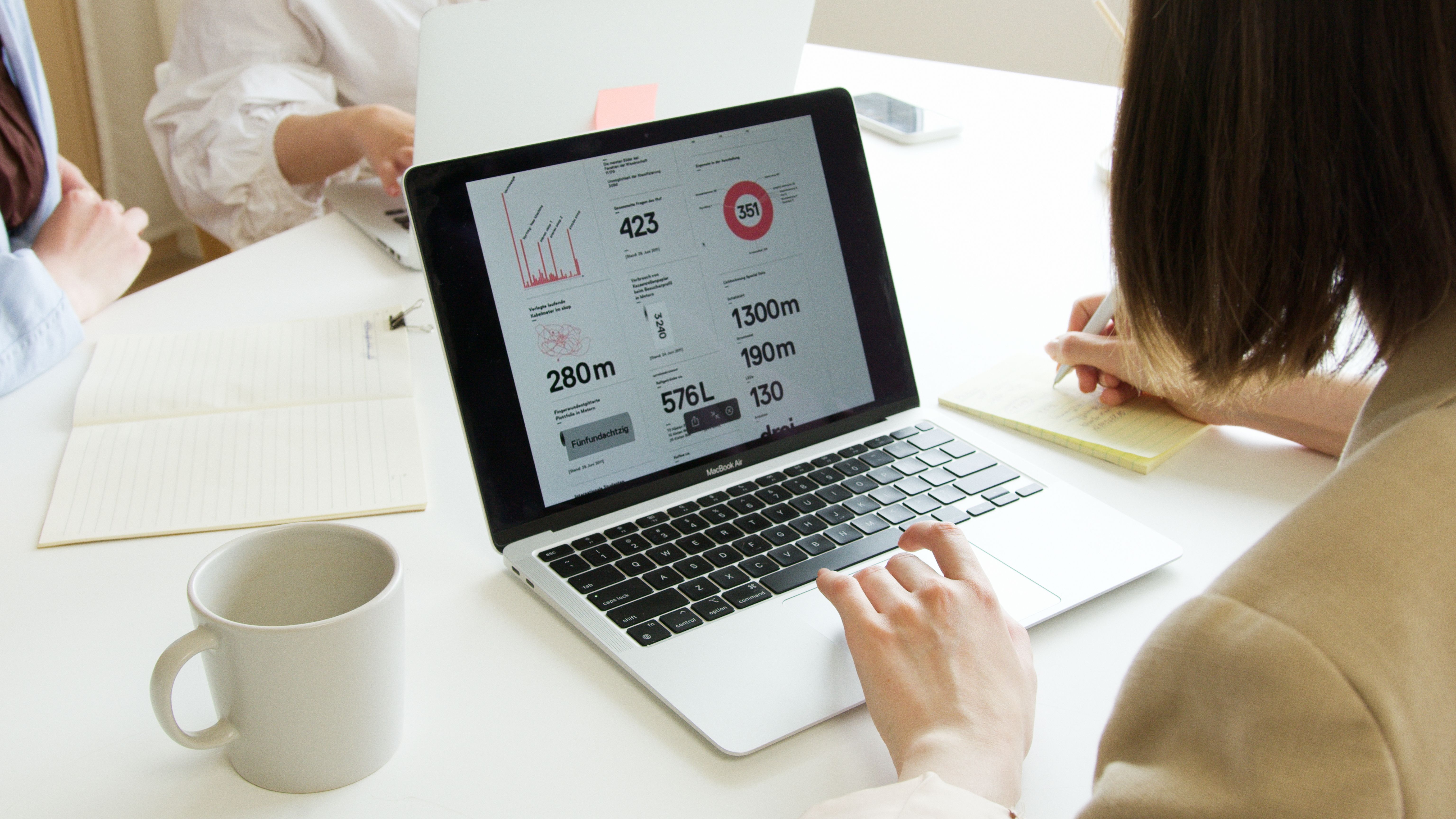 Adviser reviewing small business health insurance premium comparisons with a client